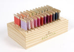 DMC Eco Vita wooden box with 24 bobbins and a magnet for holding your needle.